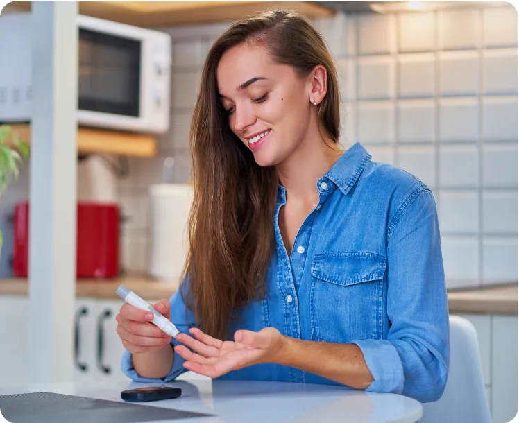 A young woman in a white shirt with blue boxing gloves.